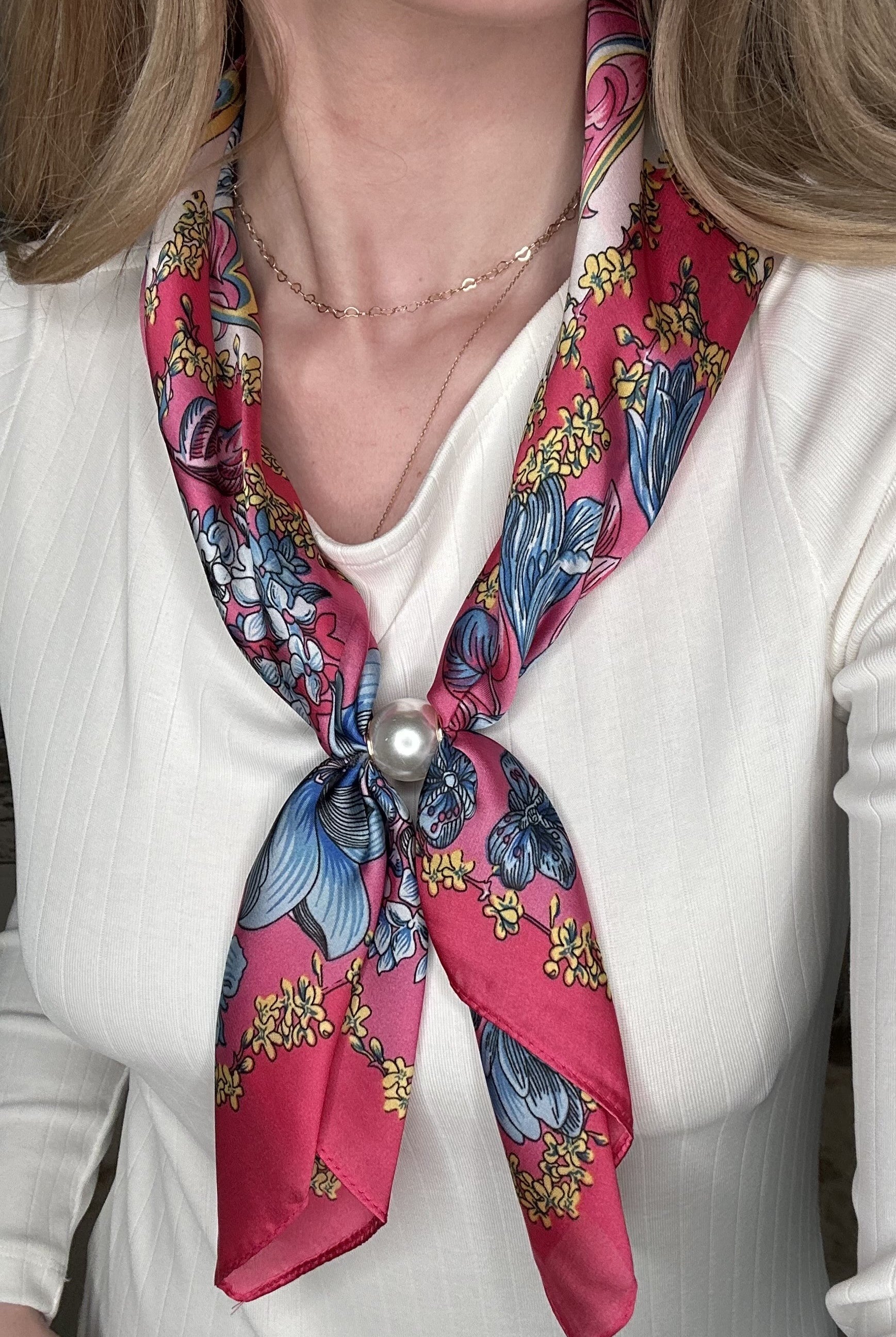 Silky fuchsia floral pearl magnetic scarf featuring vibrant pink and blue botanical prints with an elegant pearl clasp detail.