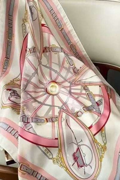 Decorative scarf with intricate design draped over a chair