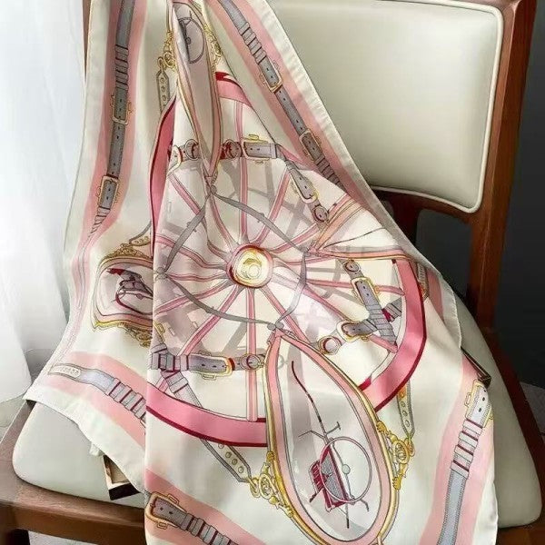 Decorative scarf with intricate design draped over a chair