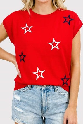 Red t-shirt with star patterns worn by a person