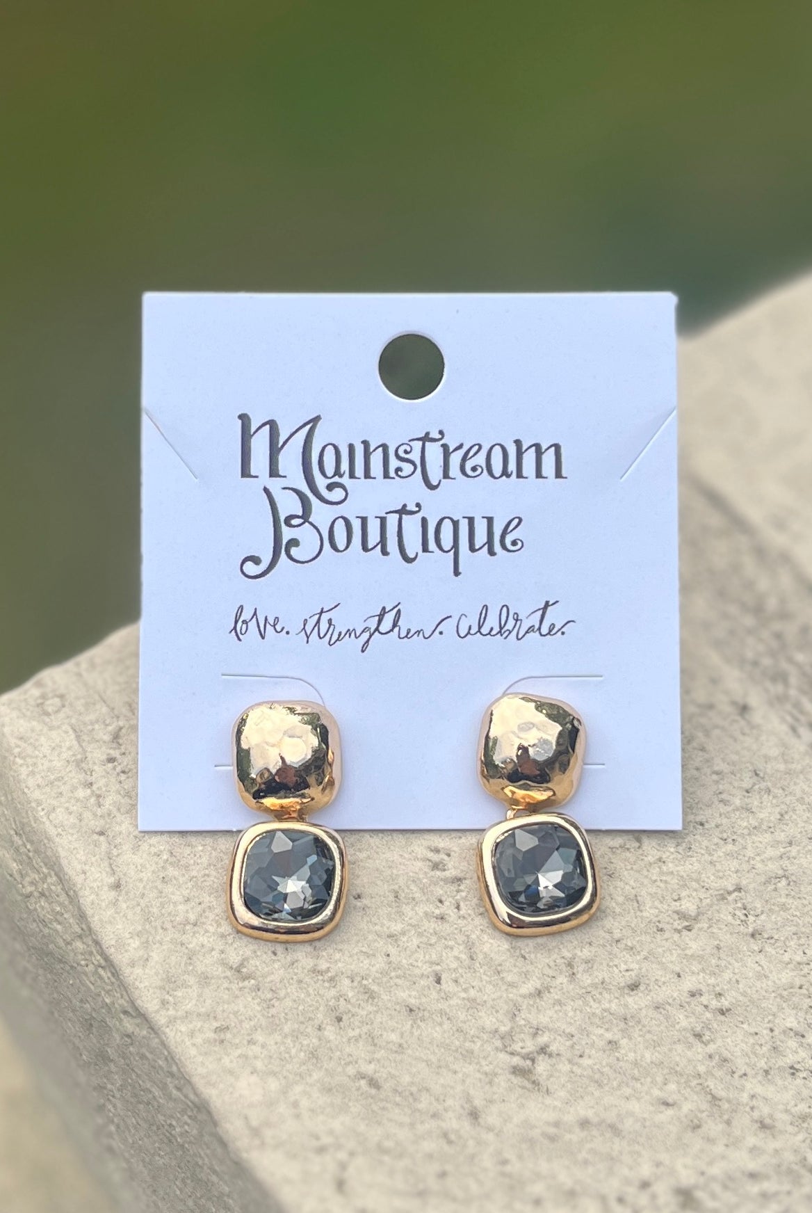Pair of gold and grey stone earrings.