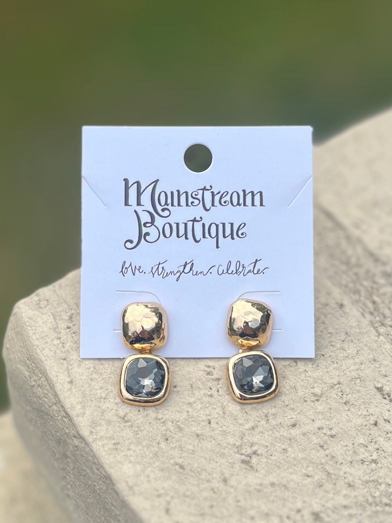 Pair of gold and grey stone earrings.