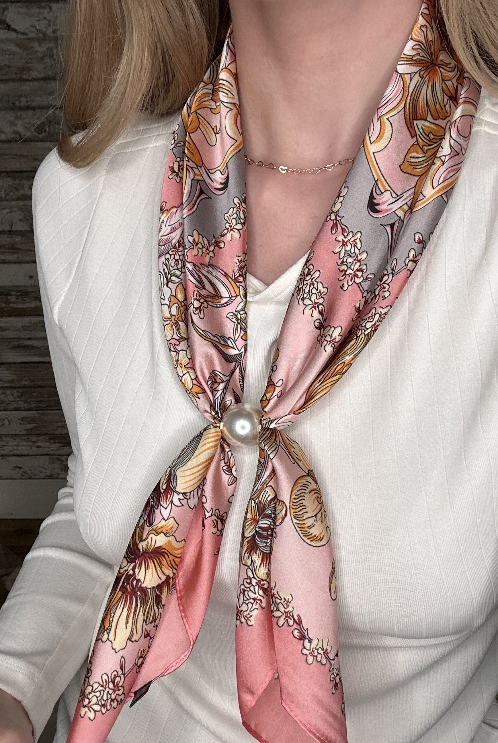 Silky blush pink pearl magnetic scarf featuring a vintage floral print with warm neutral accents and elegant pearl clasp detail.