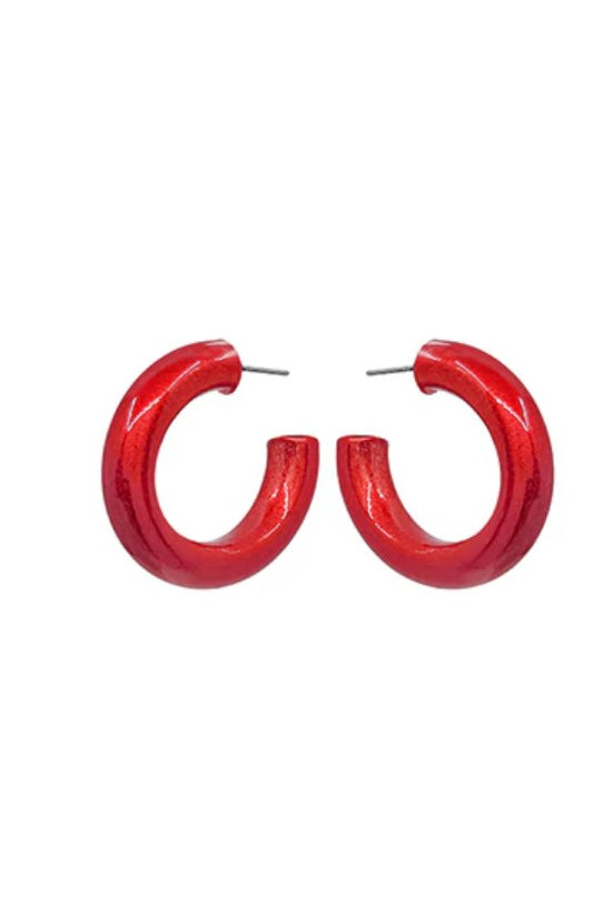Red hoop earrings on a white background