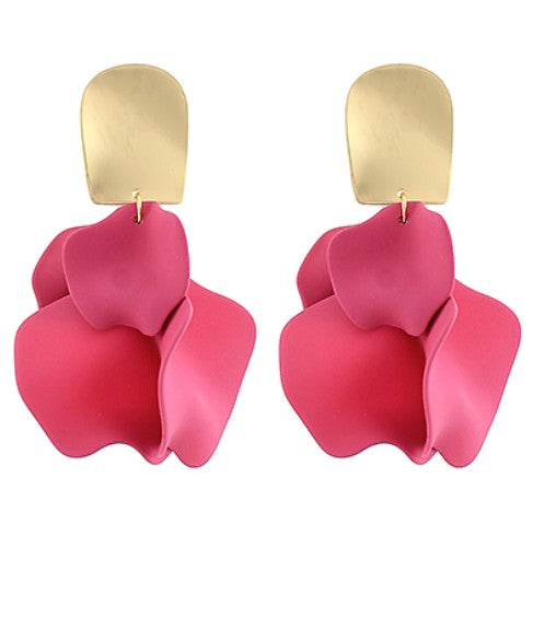 Pink earrings with gold hooks on a white background