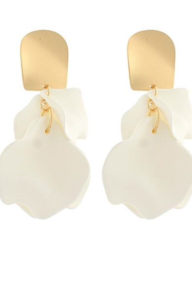 Pair of white earrings with gold accents on a white background