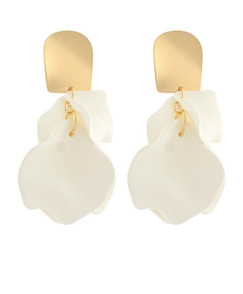 Pair of white earrings with gold accents on a white background
