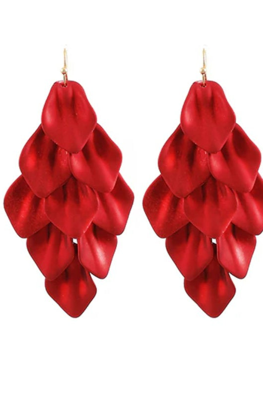 Red layered earrings on a white background