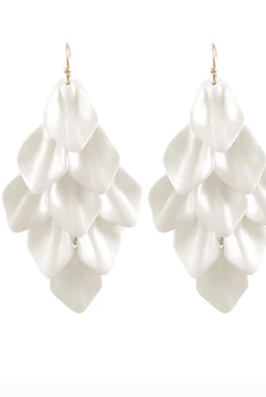 White ruffled earrings on a white background