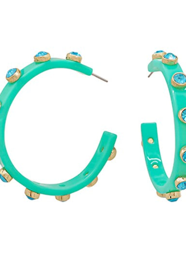Turquoise hoop earrings with gold accents on a white background