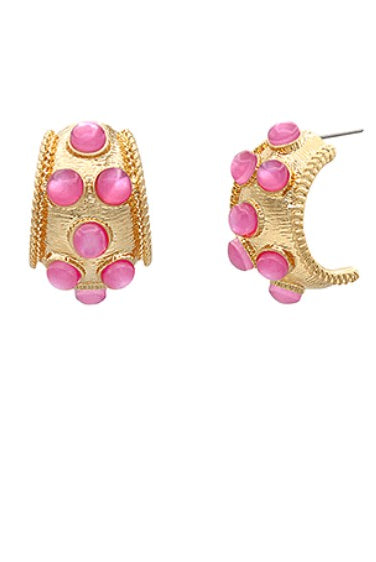 Gold hoop earrings with pink gemstones on a white background