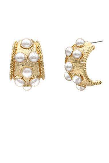 Gold hoop earrings with pearl-like beads on a white background