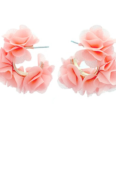 Pair of peach floral hoop earrings on a white background