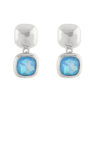Silver earrings with blue gemstones on a white background