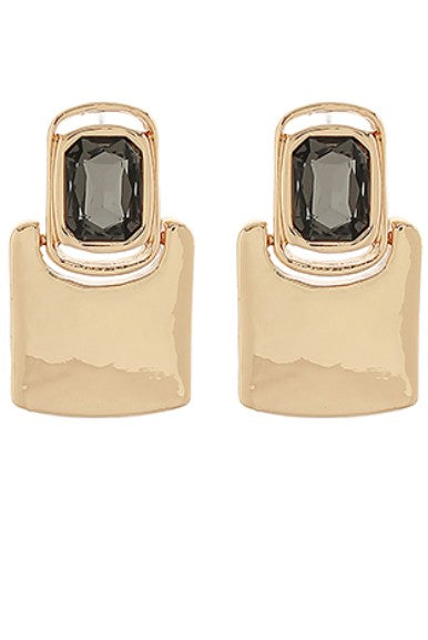 Gold hoop earrings with black gemstones on a white background