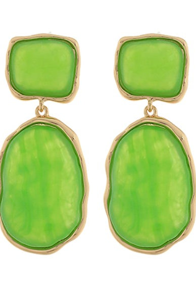 Green earrings with gold accents on a white background