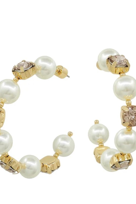 Pair of hoop earrings with pearls and gold accents on a white background