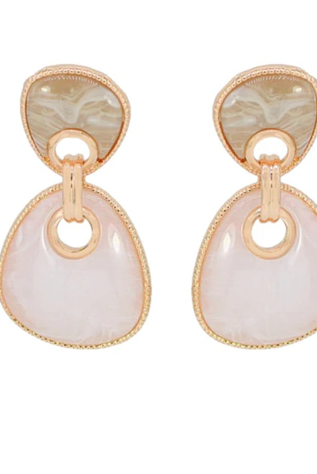 Pair of earrings with gold and beige stones on a white background