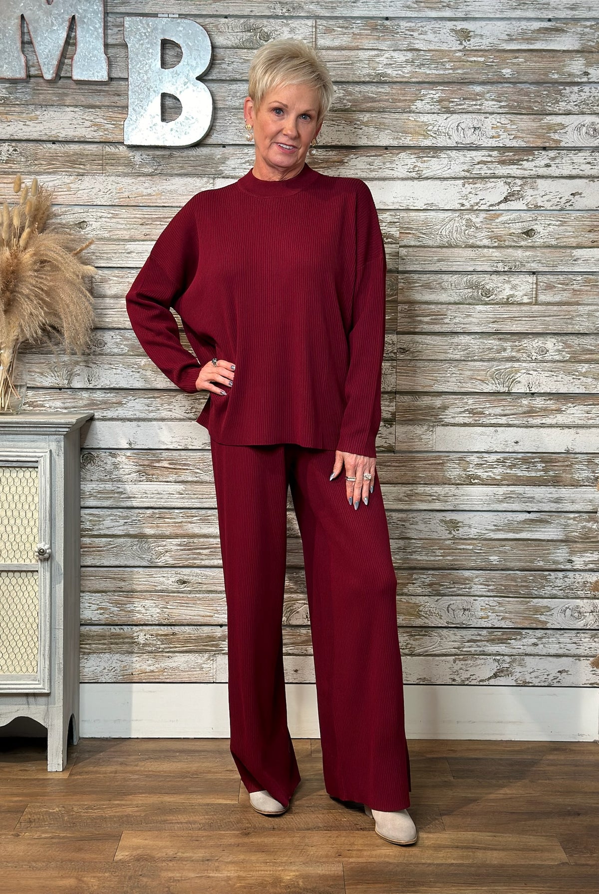 Women wearing burgundy ribbed set.