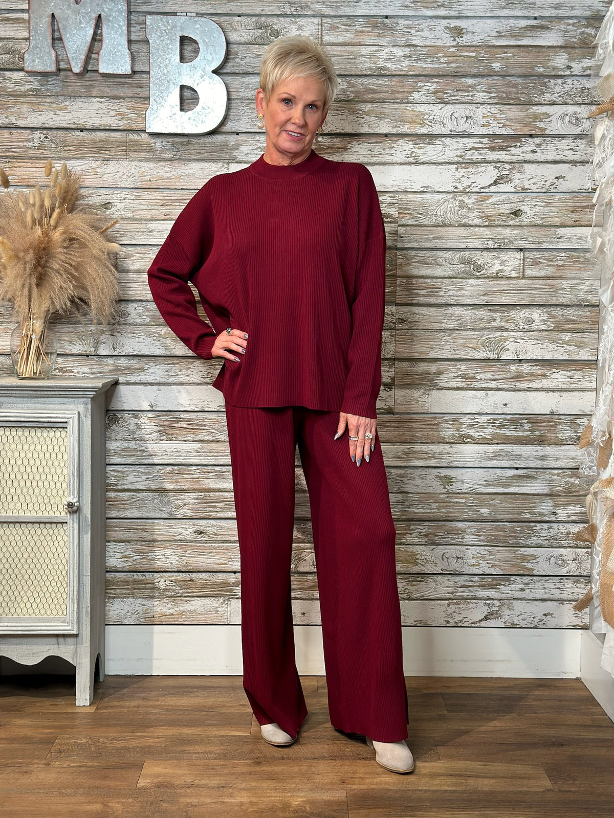 Women wearing burgundy ribbed set.