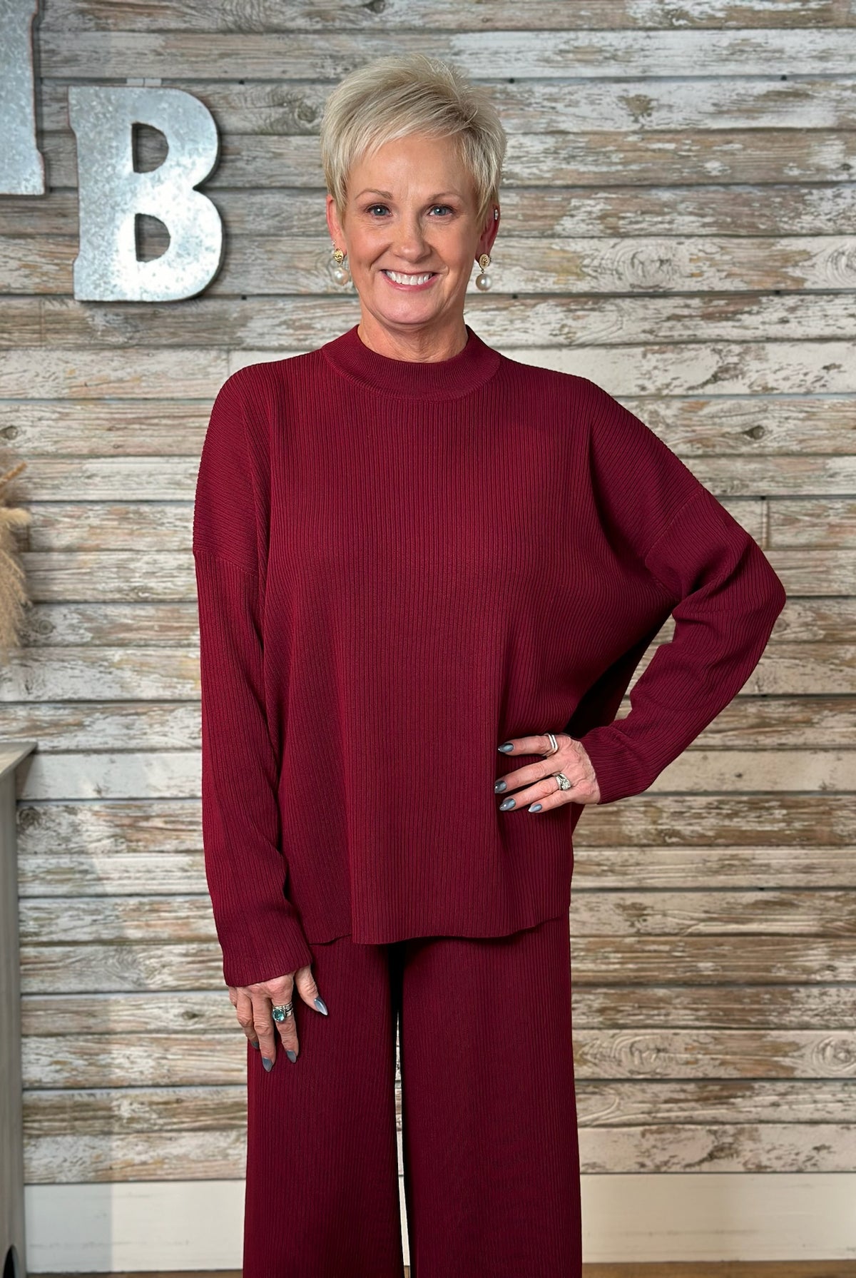 Women wearing a Burgundy Lux Ribbed Viscose Sweater & Wide-Leg Pant Cord Set