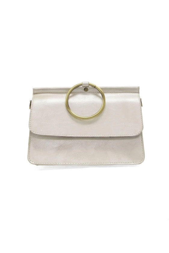 White handbag with a gold ring handle on a white background