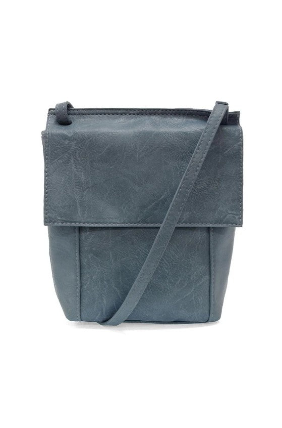 Blue leather crossbody bag on a white background