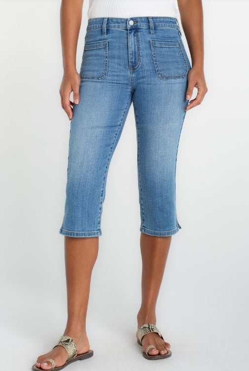 Person wearing capri blue jeans