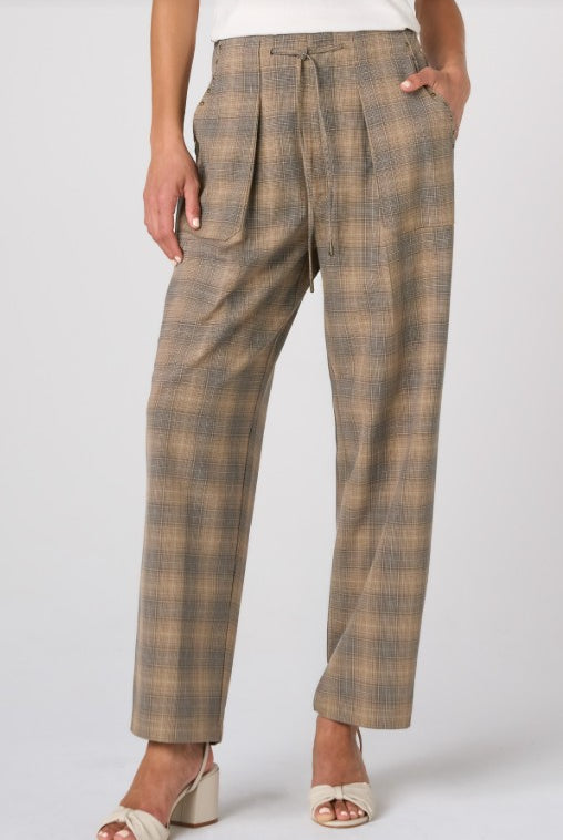 Plaid pants worn by a person on a white background
