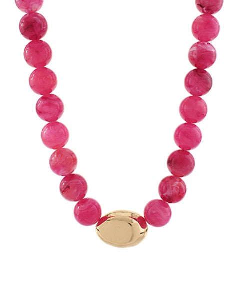 Necklace with pink beads and a gold clasp on a white background