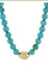 Turquoise beaded necklace with a gold pendant on a white background