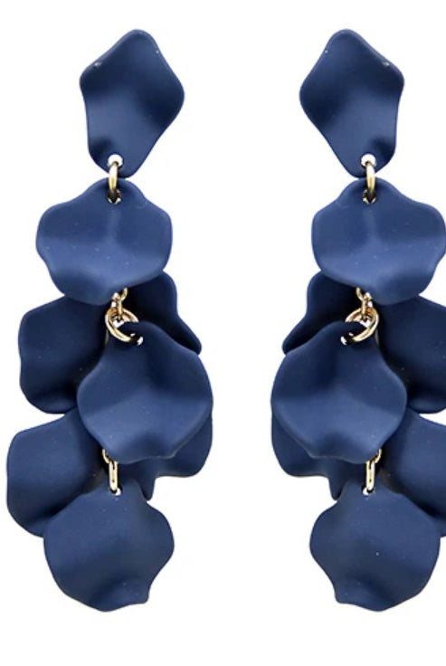 Pair of blue petal-shaped earrings on a white background