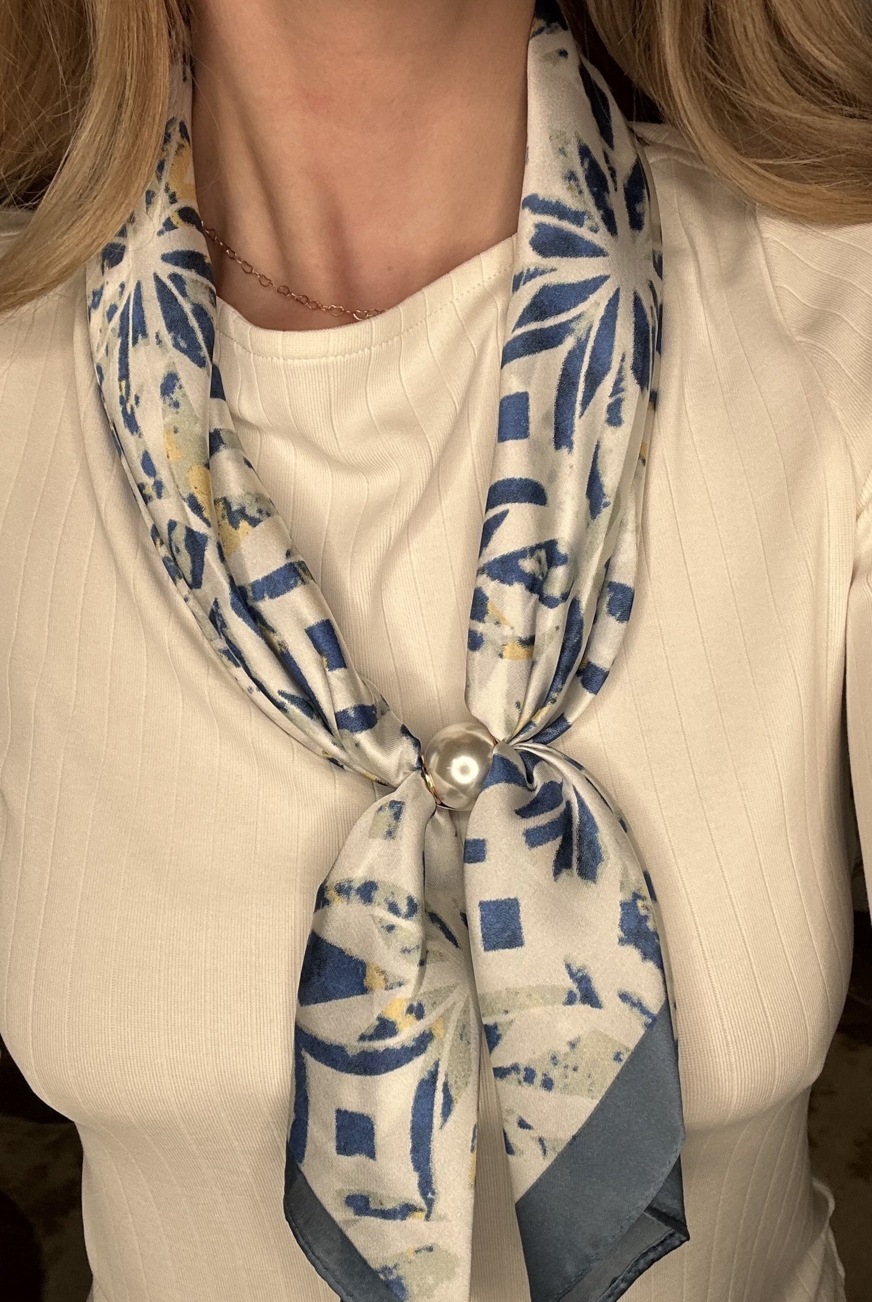 Silky royal blue abstract pearl magnetic scarf with soft geometric patterns and elegant pearl clasp detail.