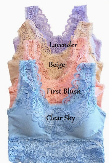 Lace tank top with color swatches labeled 'Lavender', 'Beige', 'First Blush', and 'Clear Sky' on a white background.