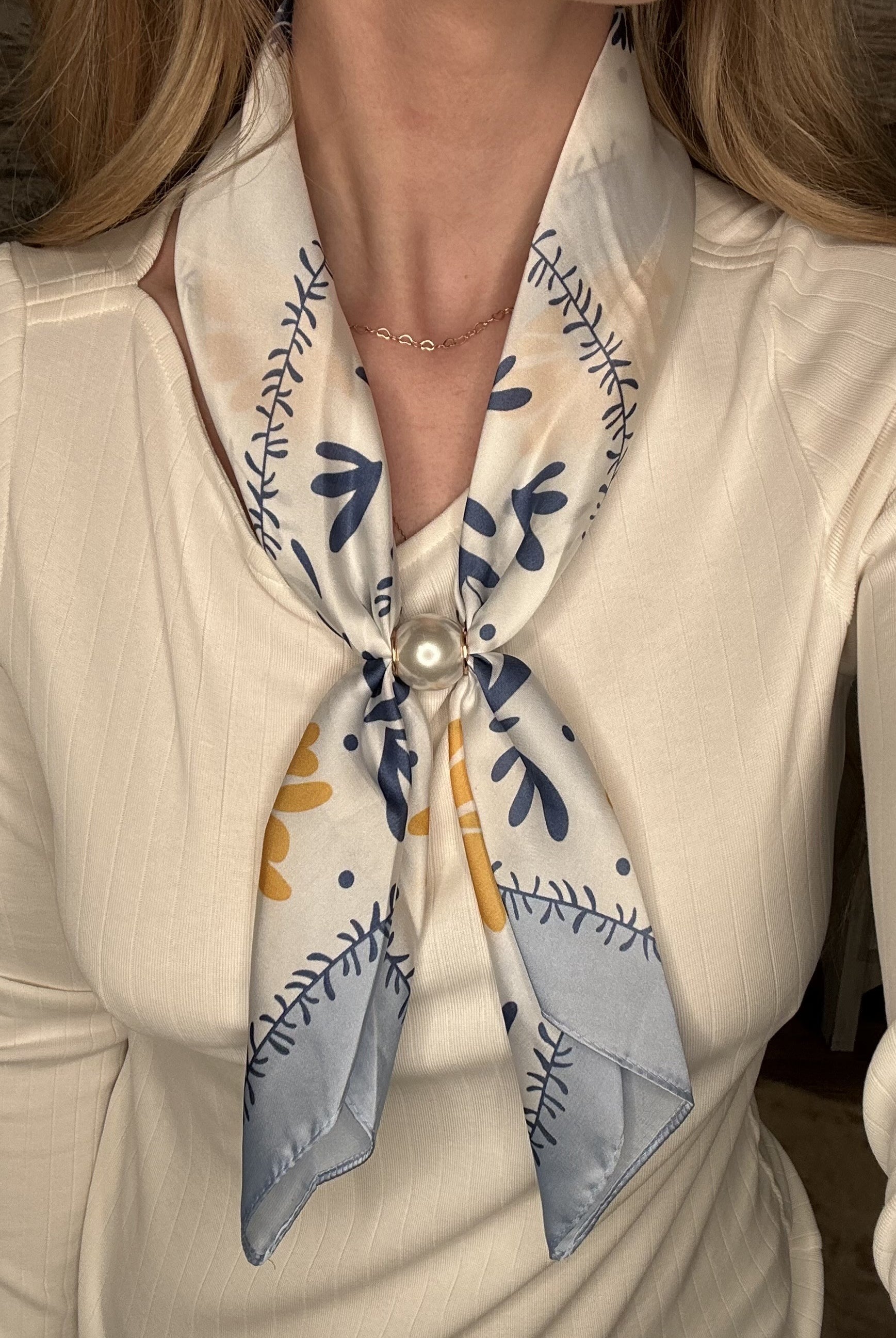 Silky blue and gold botanical pearl magnetic scarf with soft satin fabric and pearl clasp accent.