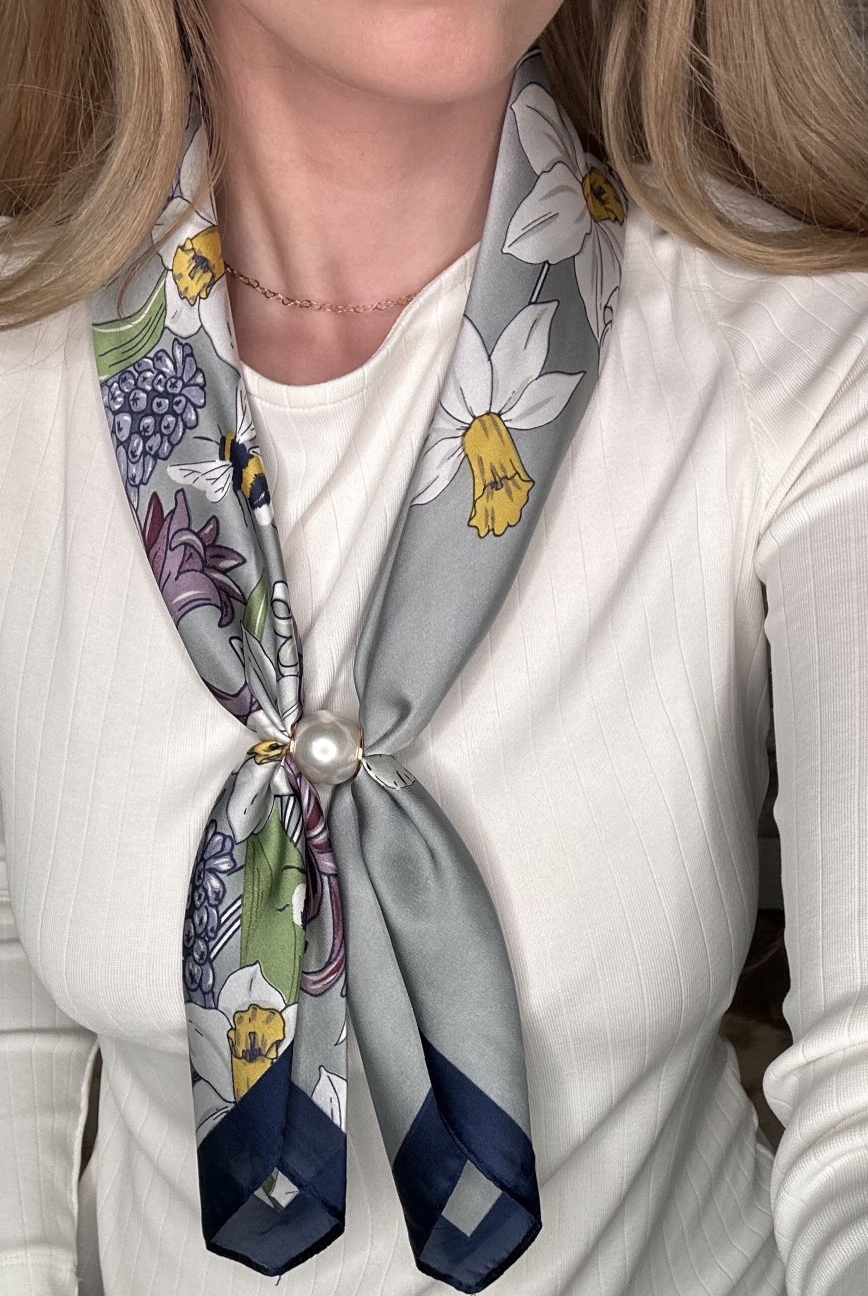 Silky lavender floral pearl magnetic scarf featuring daffodil and botanical prints with a satin finish and pearl clasp accent.