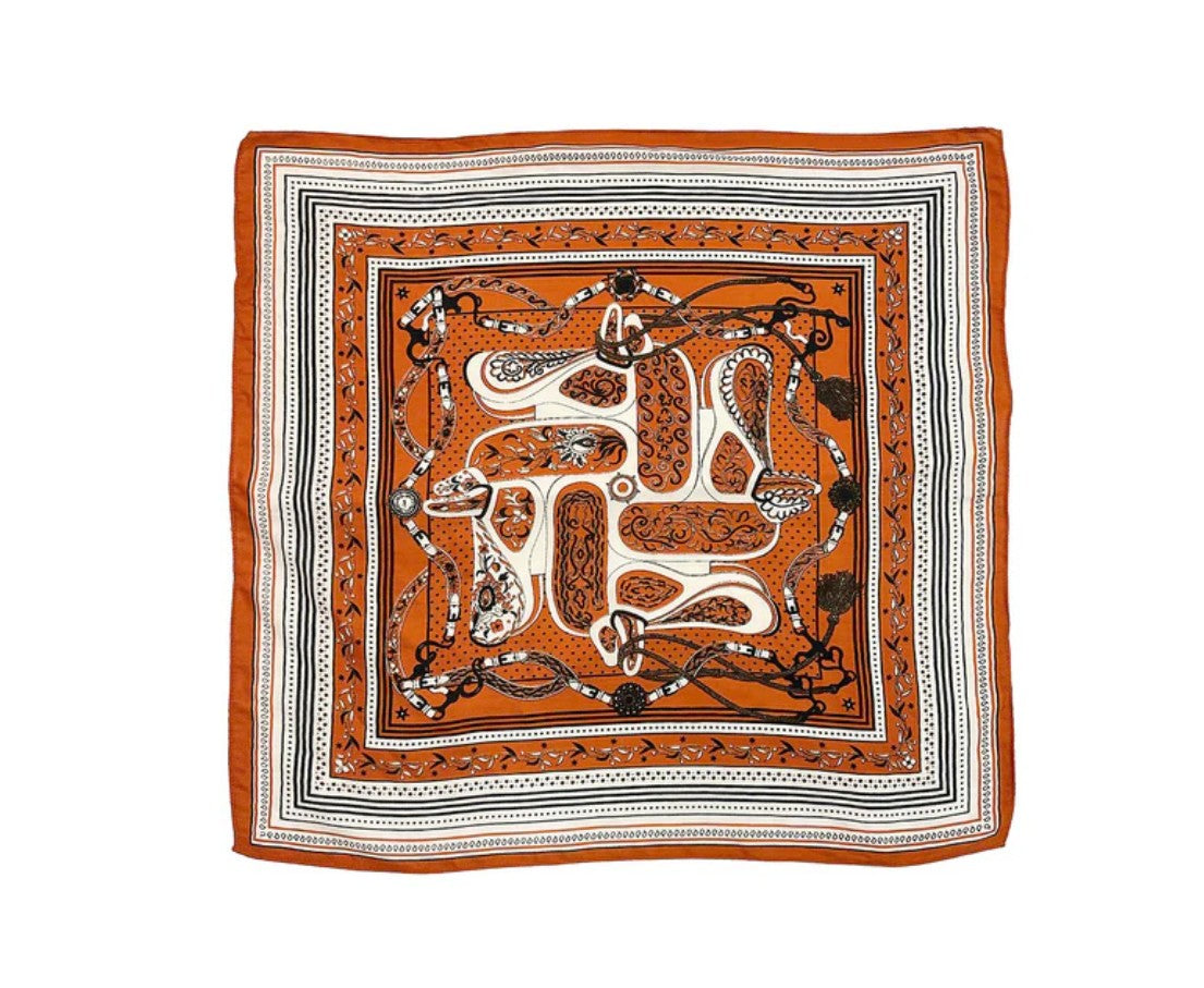 Decorative square scarf with intricate patterns on a white background