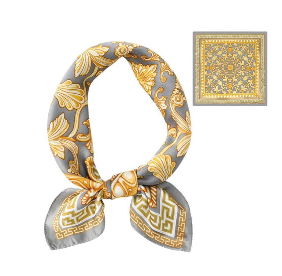 Gray and gold patterned scarf tied in a knot with a matching square on a white background