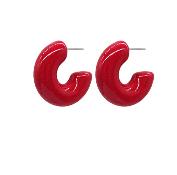 Pair of red hoop earrings on a white background