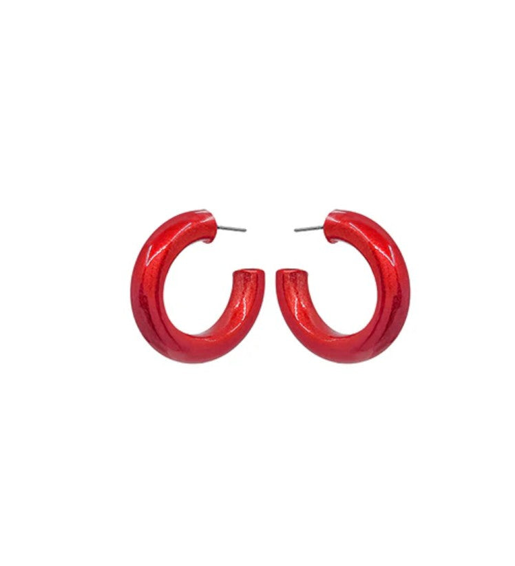 Red hoop earrings on a white background