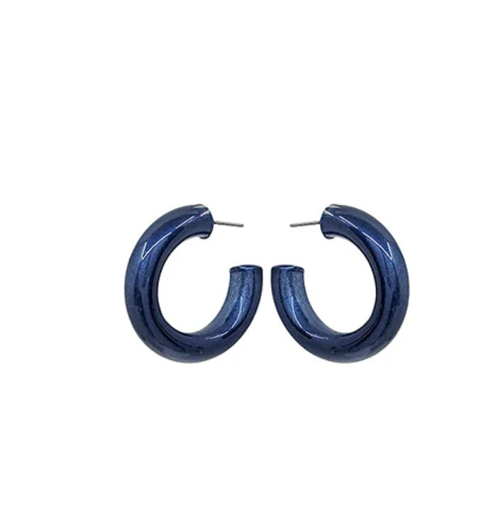Blue hoop earrings on a white background