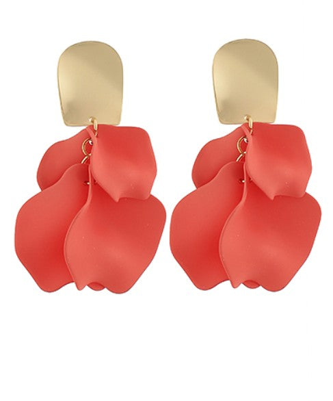 Red petal-shaped earrings with gold hooks on a white background