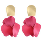 Pink earrings with gold hooks on a white background