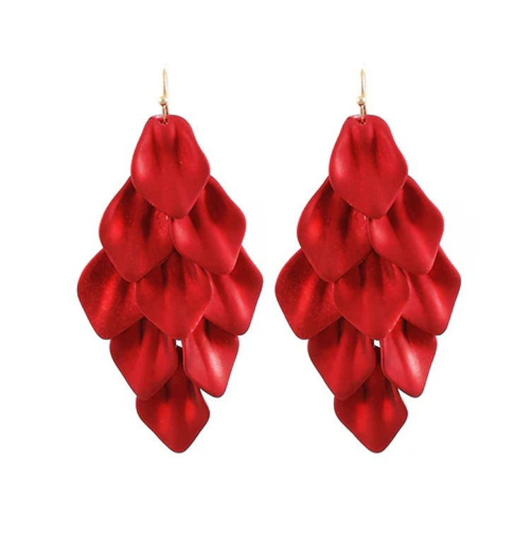 Red layered earrings on a white background