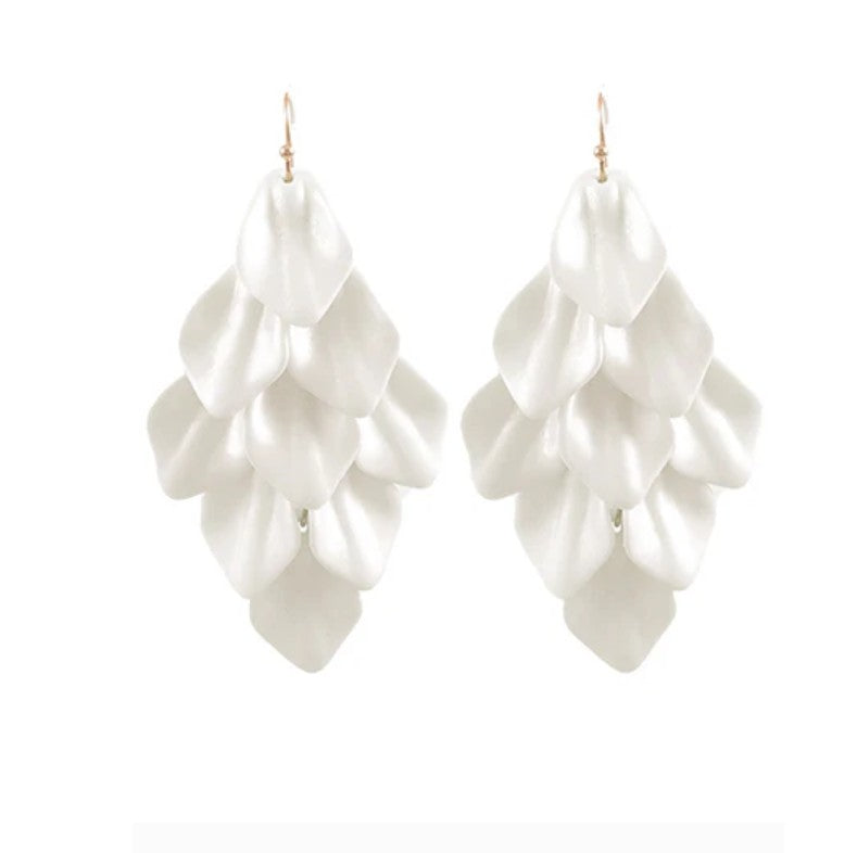 White ruffled earrings on a white background