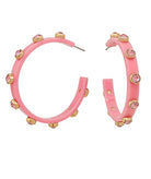 Pink hoop earrings with gold accents on a white background