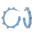 Blue hoop earrings with gold accents on a white background