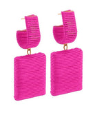 Pair of pink ribbed square earrings on a white background
