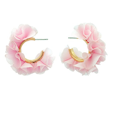 Pink floral hoop earrings on a white background