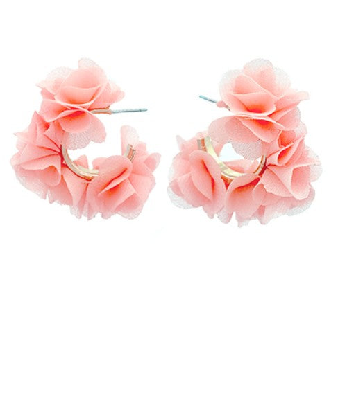 Pair of peach floral hoop earrings on a white background